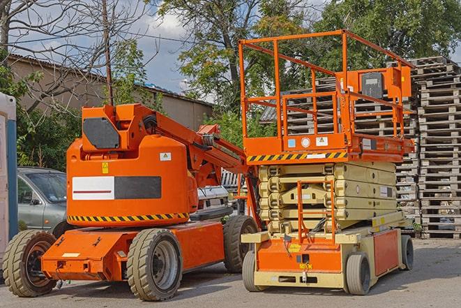 forklift operator working in busy warehouse environment in Alameda